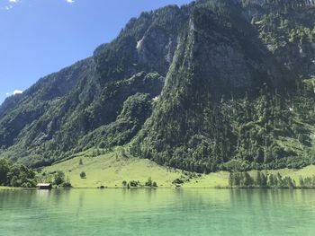 Scenic view of lake and mountains against sky