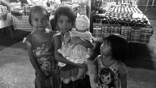 Portrait of children standing outdoors