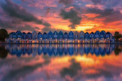 Pier over sea against sky during sunset