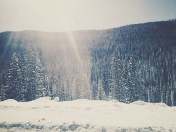 Scenic view of snow covered landscape against sky