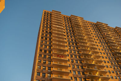 Low angle view of building against clear blue sky