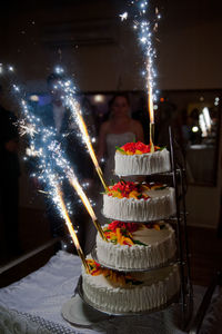 View of cake on display at night