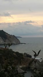 Scenic view of sea against cloudy sky