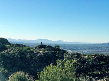 Scenic view of sea against clear blue sky