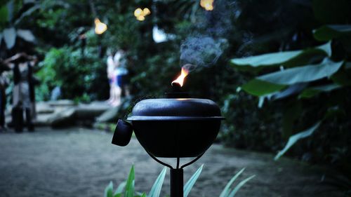 Close-up of lit tea light at night