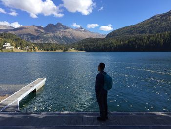 Man standing by lake
