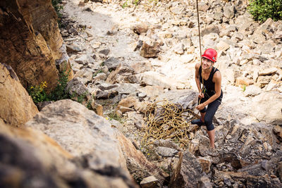 Woman standing on rock