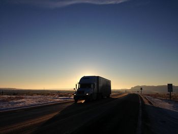 Empty road against clear sky