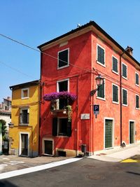 Red building against clear sky