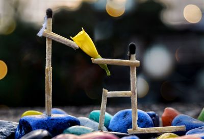 Close-up of cross on wood