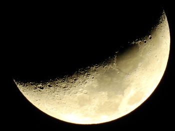 Low angle view of moon against sky at night