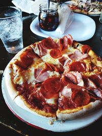 High angle view of pizza served on table