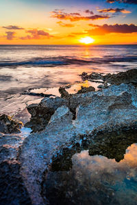 Scenic view of sea against sky during sunset