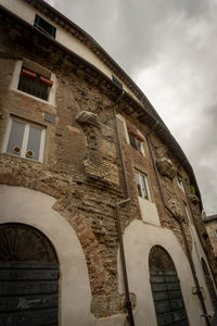 Low angle view of old building against sky