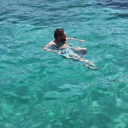 High angle view of man swimming in sea