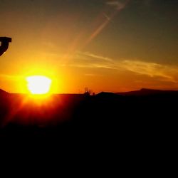 Silhouette of mountain against sky during sunset