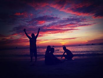 Silhouette of people on beach