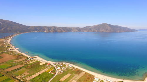 High angle view of bay against clear blue sky