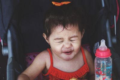 Portrait of baby girl in stroller