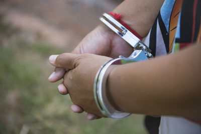 Close up. hands are handcuffed. captured prisoner or terrorist, close-up of hands in handcuffs.