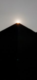 Low angle view of silhouette mountain against sky during sunset