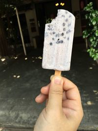 Hand holding ice cream cone