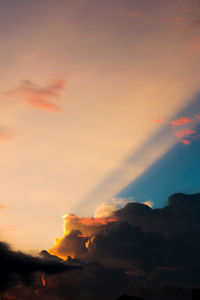 Low angle view of dramatic sky during sunset