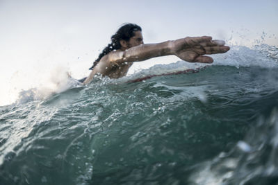 Man swimming in sea