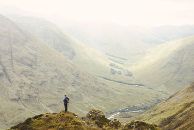 High angle view of man standing on mountain