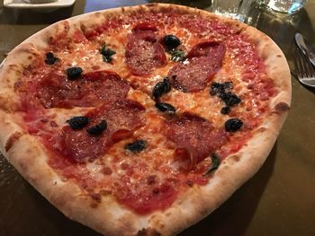 Close-up of pizza in plate on table