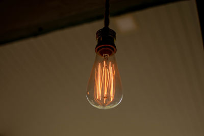 Low angle view of illuminated light bulb