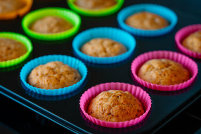 Muffins in colorful silicone trays