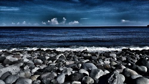 Scenic view of sea against sky at night