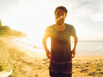 Scenic view of happy man  at the beach