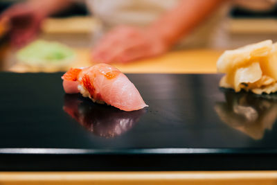 Close-up of sushi served on table