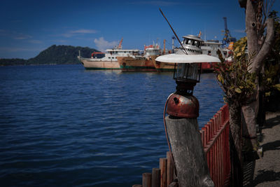 Ship moored on sea against sky