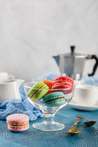 Close-up of fruits in glass bowl on table