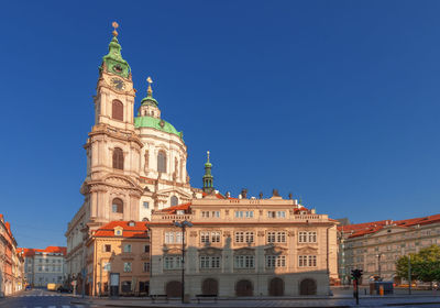 Low angle view of baroque saint nicholas cathedral on lesser town square, prague.