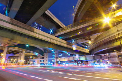 Illuminated bridge at night