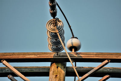 Low angle view of decoration hanging against clear sky