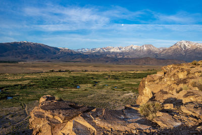 Owens river valley cliff view distant snowy peaks of eastern sierra nevada mountains california usa