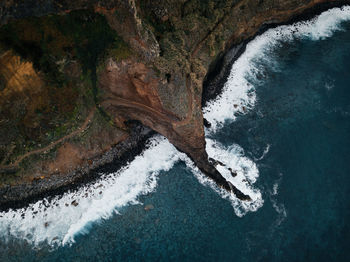 High angle view of cliff against sea