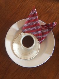 High angle view of coffee cup on table