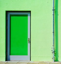 Green fascade with green door