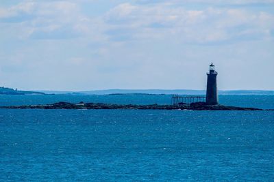 Scenic view of sea against blue sky
