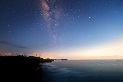 Scenic view of sea against sky at night