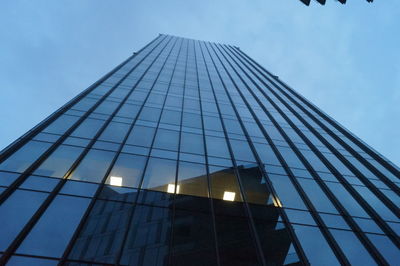 Low angle view of office building against sky