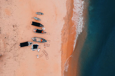 Aerial view of boats moored on beach