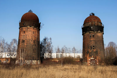 Old water tower against sky