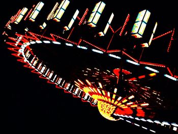 Low angle view of illuminated ferris wheel